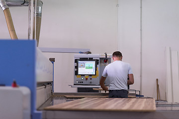 Image showing worker in a factory of wooden furniture