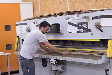 Image showing worker in a factory of wooden furniture