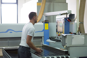 Image showing worker in a factory of wooden furniture