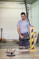 Image showing worker in a factory of wooden furniture