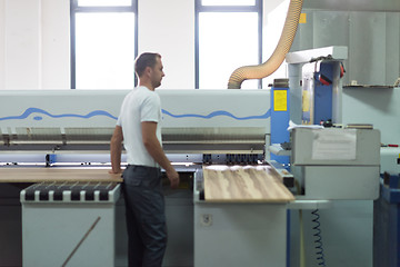 Image showing worker in a factory of wooden furniture