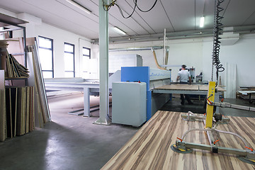 Image showing worker in a factory of wooden furniture