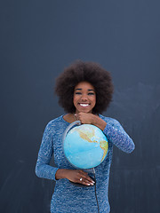 Image showing black woman holding Globe of the world