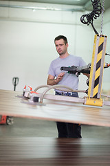 Image showing worker in a factory of wooden furniture