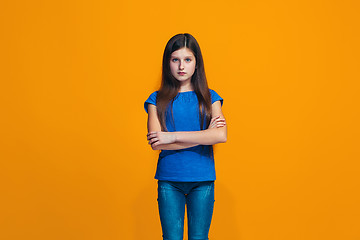 Image showing Young serious thoughtful teen girl. Doubt concept.