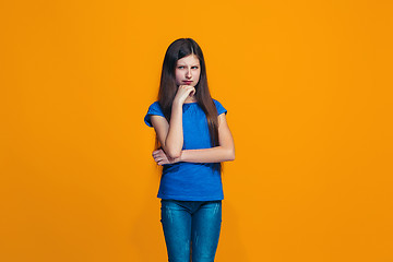 Image showing Young serious thoughtful teen girl. Doubt concept.