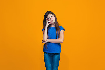 Image showing Young serious thoughtful teen girl. Doubt concept.