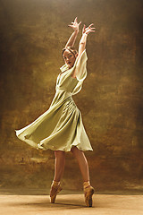 Image showing Young ballet dancer - Harmonious pretty woman with tutu posing in studio -