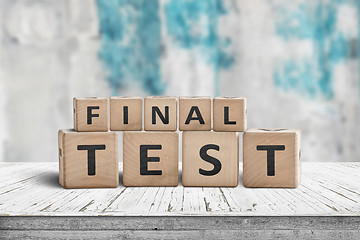 Image showing Final test spelled with letter cubes on a wooden table