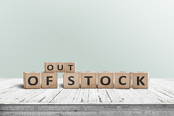 Image showing Out of stock sign standing on a wooden table
