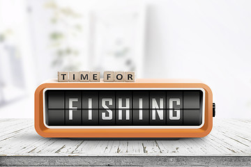 Image showing Retro alarm clock with the word fishing