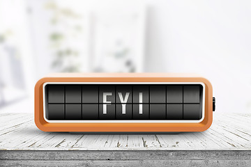 Image showing FYI message on an orange alarm clock