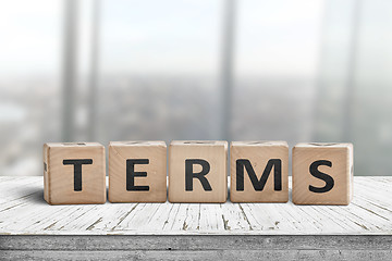 Image showing Terms sign in a bright office on a wooden desk