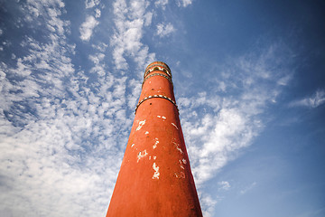 Image showing Tall red chimney tower under a blue sky