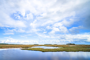 Image showing River landscape with dry plains under a blue sky