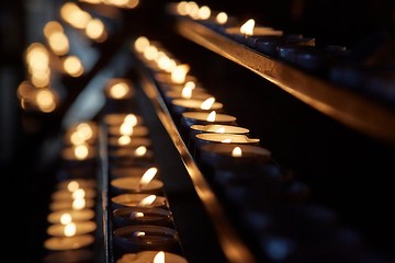 Image showing Candles in a dark church