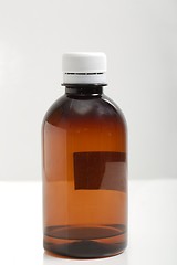 Image showing MEdicine bottle on a white table