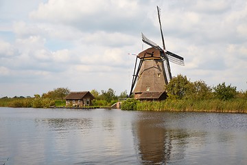 Image showing Windmill beside a canal