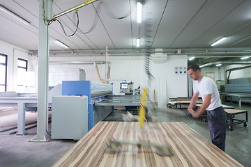 Image showing worker in a factory of wooden furniture