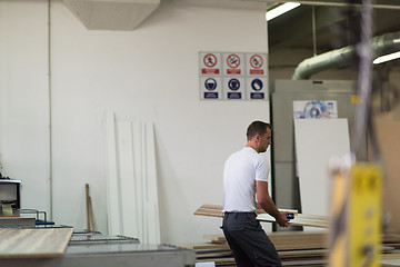 Image showing worker in a factory of wooden furniture