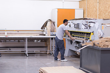 Image showing worker in a factory of wooden furniture