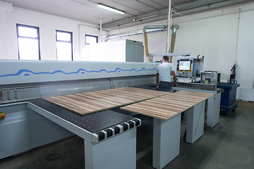 Image showing worker in a factory of wooden furniture