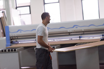 Image showing worker in a factory of wooden furniture