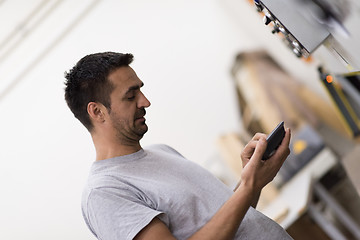 Image showing worker in a factory of wooden furniture