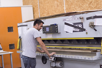 Image showing worker in a factory of wooden furniture