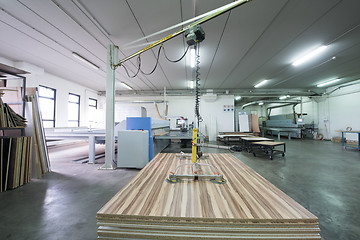 Image showing worker in a factory of wooden furniture