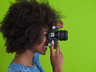 Image showing black girl taking photo on a retro camera