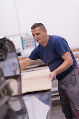 Image showing worker in a factory of wooden furniture