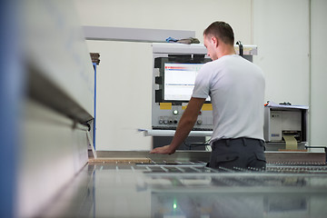 Image showing worker in a factory of wooden furniture