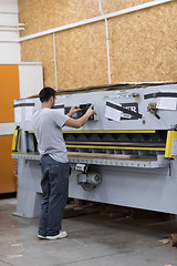 Image showing worker in a factory of wooden furniture