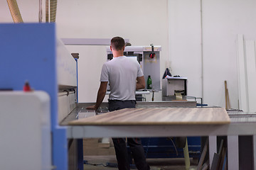 Image showing worker in a factory of wooden furniture