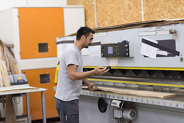 Image showing worker in a factory of wooden furniture