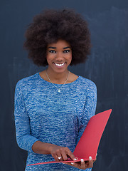 Image showing African American woman with red folder