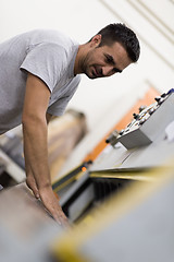 Image showing worker in a factory of wooden furniture