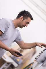 Image showing engineer in front of wood cutting machine