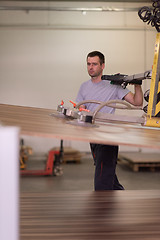 Image showing worker in a factory of wooden furniture