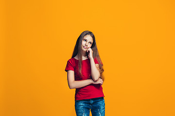 Image showing Young serious thoughtful teen girl. Doubt concept.