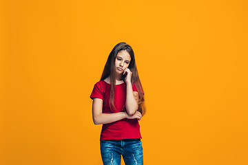 Image showing Young serious thoughtful teen girl. Doubt concept.