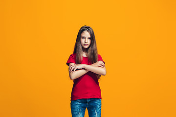 Image showing Young serious thoughtful teen girl. Doubt concept.