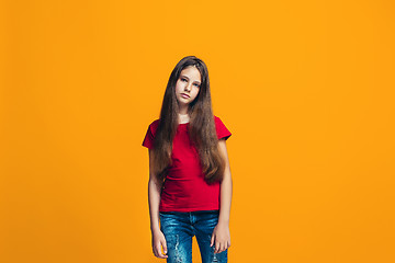 Image showing Young serious thoughtful teen girl. Doubt concept.