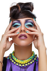 Image showing Beautiful girl with bright vivid purple make-up 