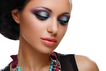 Image showing Beautiful girl with bright vivid purple and green make-up 