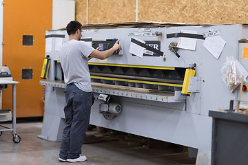 Image showing worker in a factory of wooden furniture