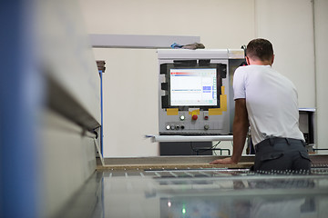 Image showing worker in a factory of wooden furniture