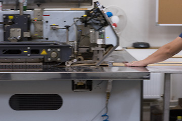 Image showing engineer in front of wood cutting machine