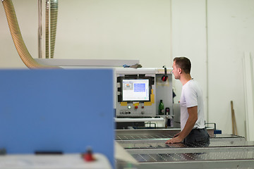 Image showing worker in a factory of wooden furniture